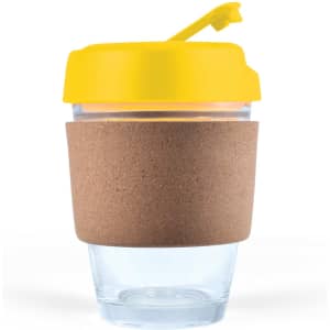 A reusable coffee cup with a transparent body, a cork band for insulation, and a bright yellow lid.