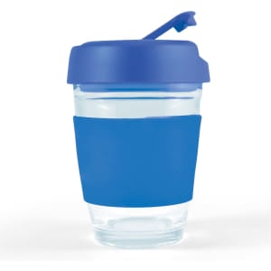 A reusable coffee cup with a transparent body and a blue silicone sleeve and flip lid.