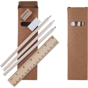 A stationery set packaged in a brown box containing three wooden pencils, a sharpener, an eraser, and a ruler.
