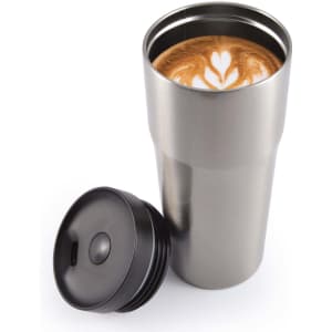 A stainless steel travel mug with a black lid, filled with a coffee beverage featuring latte art.