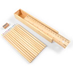 A set of wooden coloured pencils in various colors, a sharpener, and a measuring ruler all in a wooden box.
