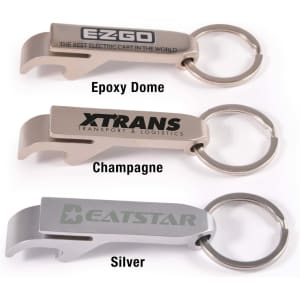 A drink bottle opener keytag in three colours: champagne, silver, and one with an epoxy dome, featuring branding.
