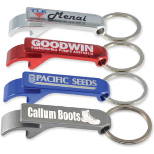 A collection of four bottle opener keyrings in silver, red, blue, and grey, each featuring a logo or branding.