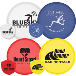 A collection of colorful flying discs in red, yellow, blue, and white, featuring various logos and branding.