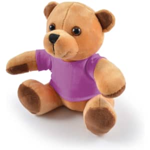 A plush teddy bear in tan with brown accents, wearing a purple shirt, sitting upright.