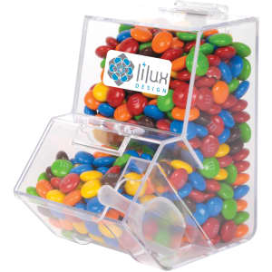 A clear dispenser filled with colourful M&M's, featuring a branding logo on the front.
