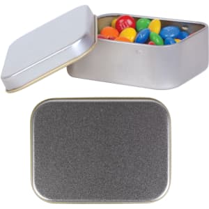 A silver rectangular tin filled with colorful M&M's candies, with an open lid revealing the contents.