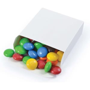 A box of colorful M&M's with green, blue, yellow, red, and brown choc beans spilling out.