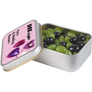 A silver rectangular tin filled with green and black jelly beans. The tin has a branding logo on the lid.