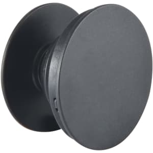 A black phone grip with a circular design, featuring a smooth surface and a branding logo.