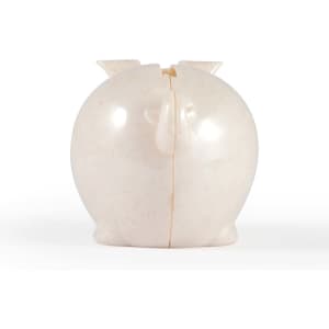 A small, cream-colored pig-shaped coin bank with a smooth, rounded body and tiny ears.