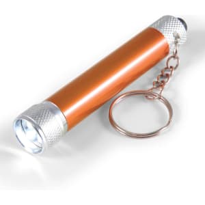 An orange Orion Torch with a silver keychain attachment and a bright LED light at one end.