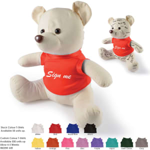 A plush bear in a red shirt, featuring a cream colour with signatures and a logo on its torso.