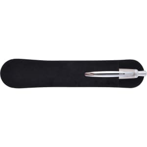 A silver metal pen rests on a black velvet-like holder, showcasing its sleek design and finishing.