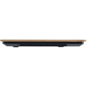 A sleek Hercules Kitchen Scale with a minimalistic design featuring a wooden platform and a black base.