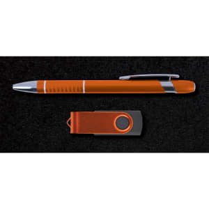 A pen and a USB flash drive are arranged on a dark background, showcasing the Alliance Gift Set.