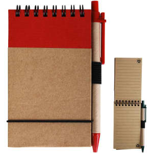 A red and brown cardboard notebook with a spiral spine and a matching pen, featuring an elastic band and a smaller notebook.