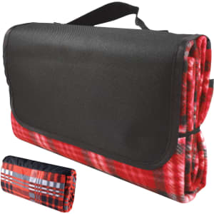 A red and black checkered picnic blanket, folded and secured with a strap, featuring a black carrying handle.