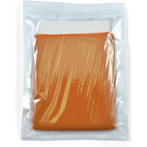 A compact orange cooling towel, neatly packed in a transparent pouch.