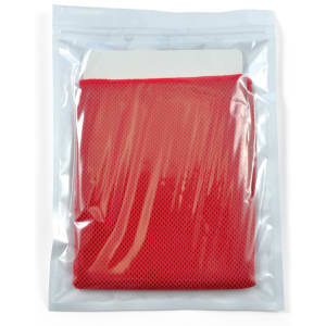 A red cooling towel packaged in a transparent pouch.
