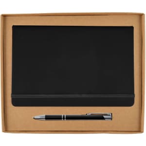 A cardboard gift set featuring a black notebook and a silver pen, packaged neatly in a brown box.