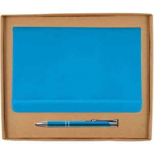 A blue notebook and blue pen are displayed inside a cardboard gift set box. The box is open.