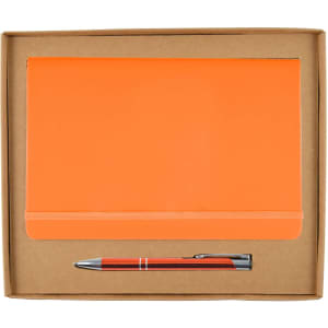 An orange notebook and a silver pen are neatly presented in a brown cardboard gift box.