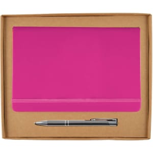 A pink notebook and a silver pen packaged together in a cardboard gift set.
