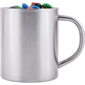 A stainless steel mug filled with colorful M&M's candies.