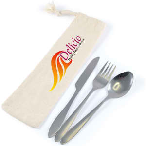 A cutlery set in silver, featuring a knife, fork, and spoon, housed in a cream calico pouch with a logo.