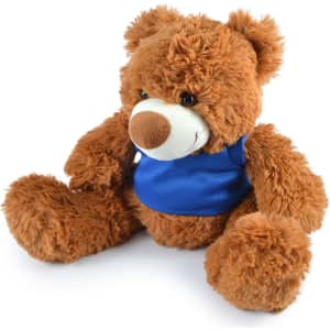 A plush teddy bear in a brown color with a blue shirt, featuring soft fur and a friendly face.