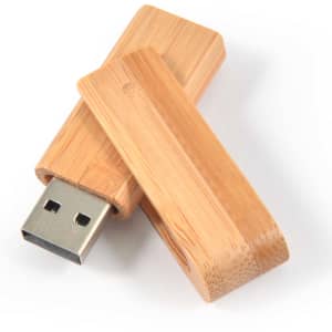 A bamboo USB flash drive in natural wood color, featuring a removable cap and metallic connector.