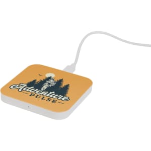 A square yellow wireless charger with a white base, featuring a logo and illustration of trees and a figure.