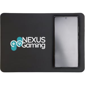A wireless charger and mouse pad featuring the Nexus Gaming logo, with a smartphone placed on the charging area.
