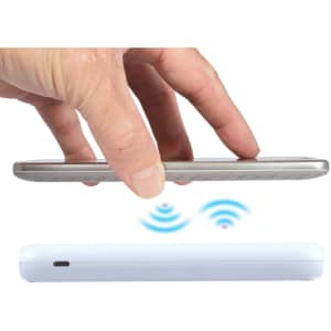 A hand hovering over a white wireless power bank, with an indication of wireless charging in blue above it.