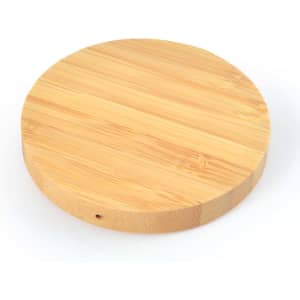 A round bamboo wireless charger featuring a smooth, natural wood finish.