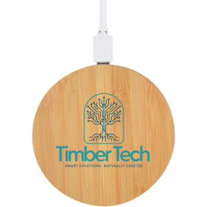 A round bamboo wireless charger with a white cable and a logo on the surface.