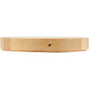 A round bamboo wireless charger with a smooth surface and a subtle logo, showcasing its natural wood texture.
