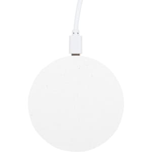 A round, white wireless charger with a textured surface and a connected charging cable.