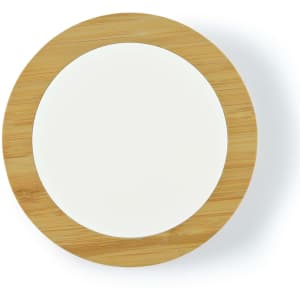 A round wireless charger with a bamboo exterior and a white center, designed for fast charging of devices.