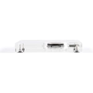 A clear crystal wireless charger with a sleek design and metallic accents. It features a logo on the surface.