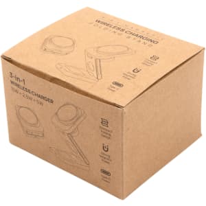 A brown cardboard box containing the Spartan 3-in-1 wireless charger, featuring illustrations and a logo.