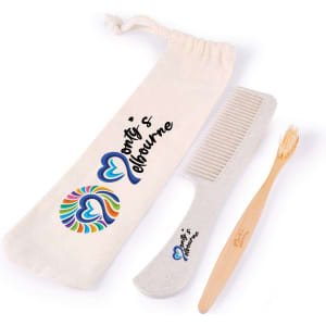 A biodegradable comb, bamboo toothbrush, and a pouch with a colourful logo, all in natural tones.
