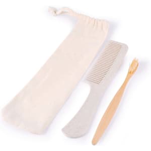 A toiletry travel pack featuring a bamboo toothbrush, a comb, and a drawstring pouch for storage.