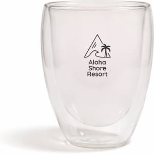 A drink bottle featuring a clear double wall design with a black logo and a mountain and palm tree graphic.