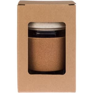 A reusable coffee cup in a cardboard box features a cork band and a white lid, combining natural materials and style.