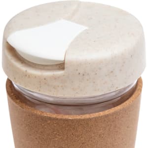 A reusable coffee cup with a cork band and a light-colored lid featuring a sliding opening.