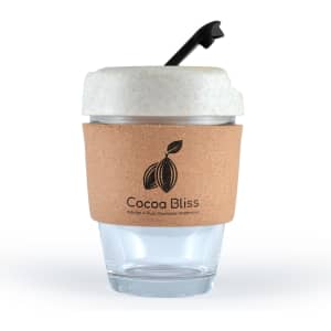A reusable coffee cup with a clear glass body, a cork band, and a light-colored lid with a straw. It has a logo.