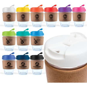 A reusable coffee cup with a cork band, featuring various lid colours including white, orange, pink, blue, and black.
