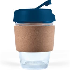 A reusable coffee cup featuring a clear body, a navy blue lid, and a cork band for insulation.